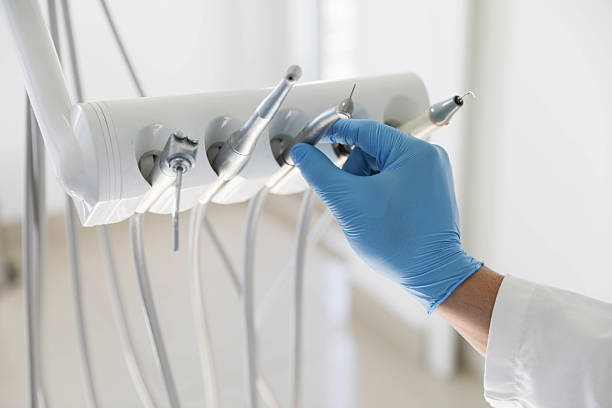 Professional Tooth Extraction technician working in Lewisville, NC